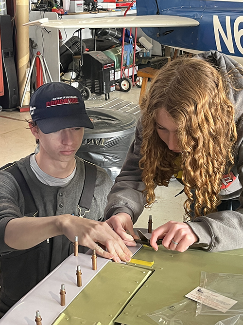 Students working on aircraft